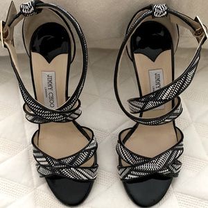 Beautiful black and white Jimmy Choo Sandel. In excellent condition.